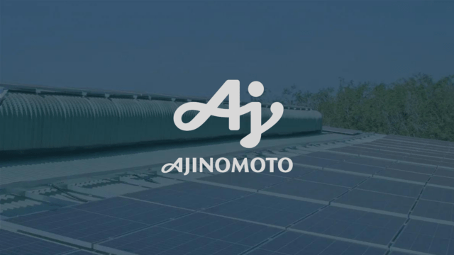 Ajinomoto logo over an image of solar panels