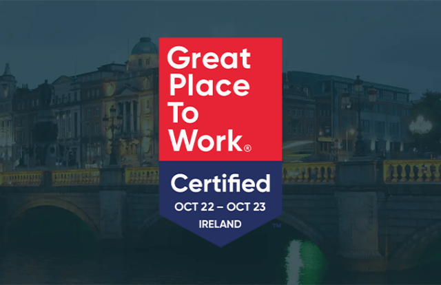 Great Place to Work logo laid over an image of a grand building