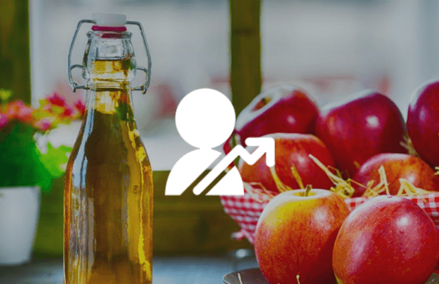 Apples and oil on a table