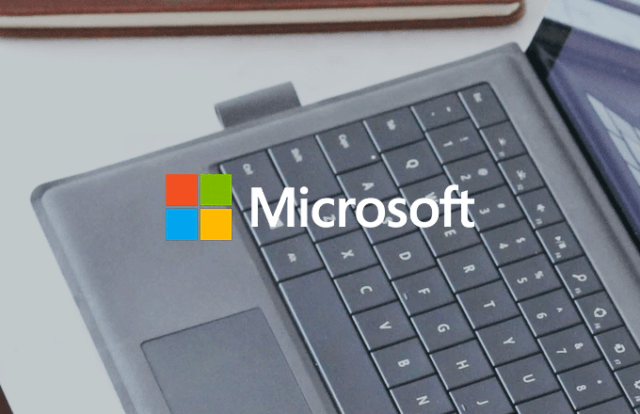 Microsoft logo over a laptop keyboard