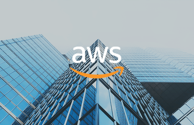 tall glass building with AWS logo over image