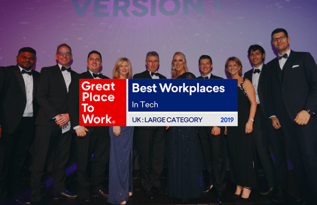 Great Place to Work logo laid over a line of people at an award event