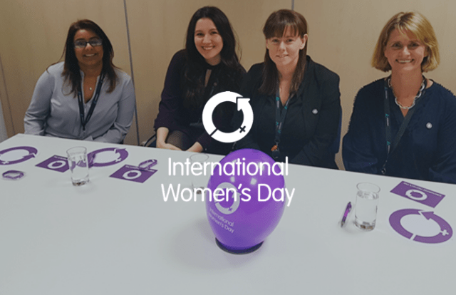 International Women's Day 2019 - 4 people sat at a table with a balloon