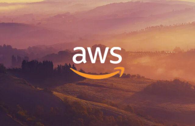 AWS logo over a sunrise landscape